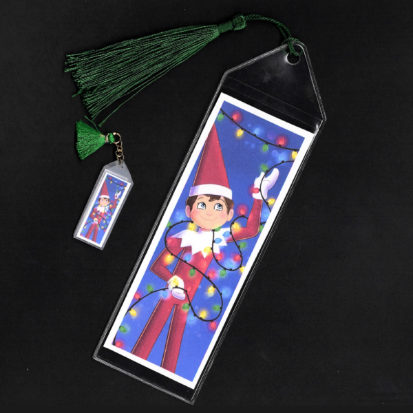 Blue-eyed boy Elf on the Shelf bookmark and mini bookmark with green tassel by L.C. Ireland, accordingtolc