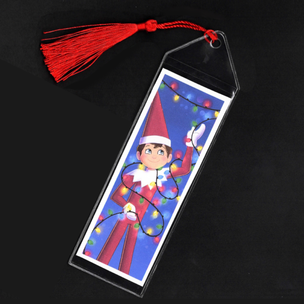 Blue-eyed boy Elf on the Shelf bookmark with red tassel by L.C. Ireland, accordingtolc